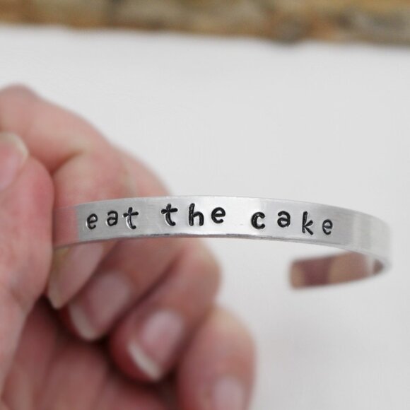 Eat The Cake - Hand Stamped Anodized Aluminum Bangle - Adjustable - Picture 1 of 11